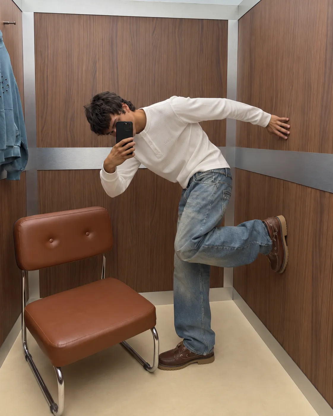 Standing mirror portrait wearing the Matteo Henley beside a brown chair